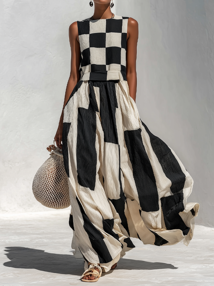 Black and white check-and-stripe sleeveless maxi dress with gathered waist and pockets