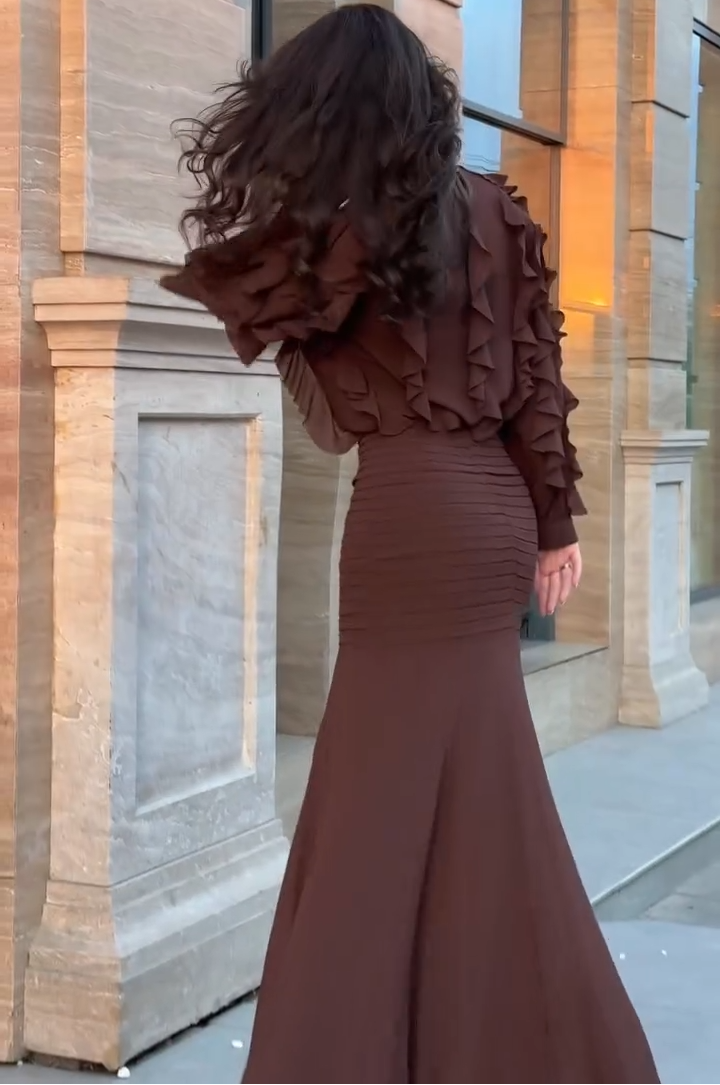 Brown ruffle long-sleeve top and ribbed mermaid maxi skirt set, side-angled view