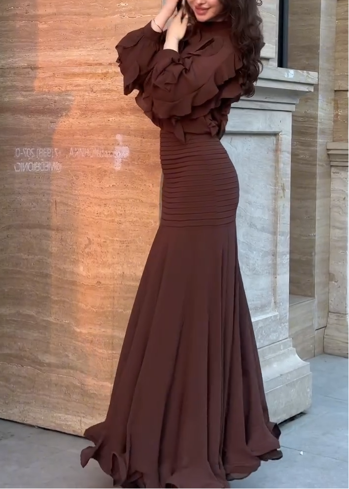 Brown ruffle long-sleeve top and ribbed mermaid maxi skirt set, hand-on-hair pose
