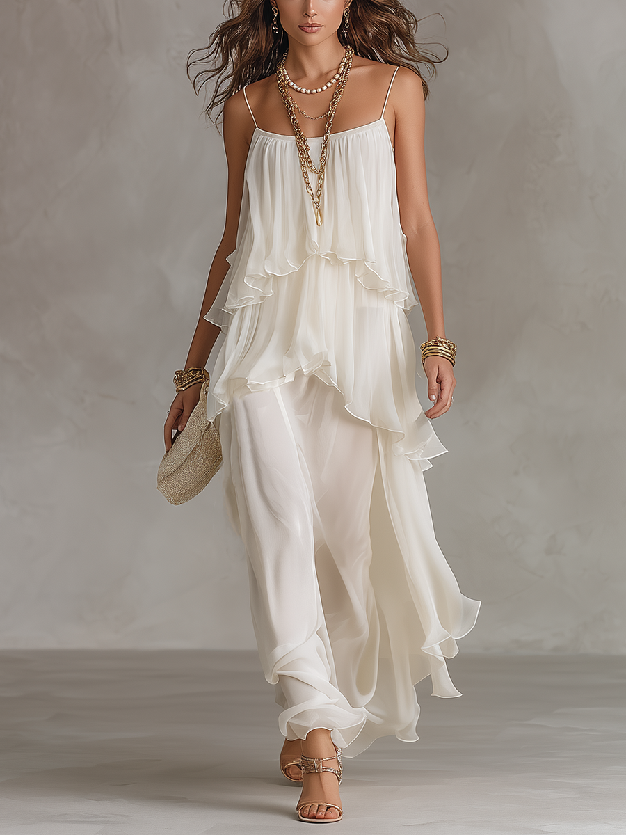 White sheer tiered chiffon maxi dress with spaghetti straps and layered ruffles