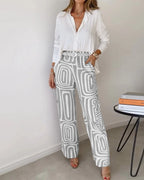 Two-piece set: white button-front blouse with gray patterned wide-leg pants