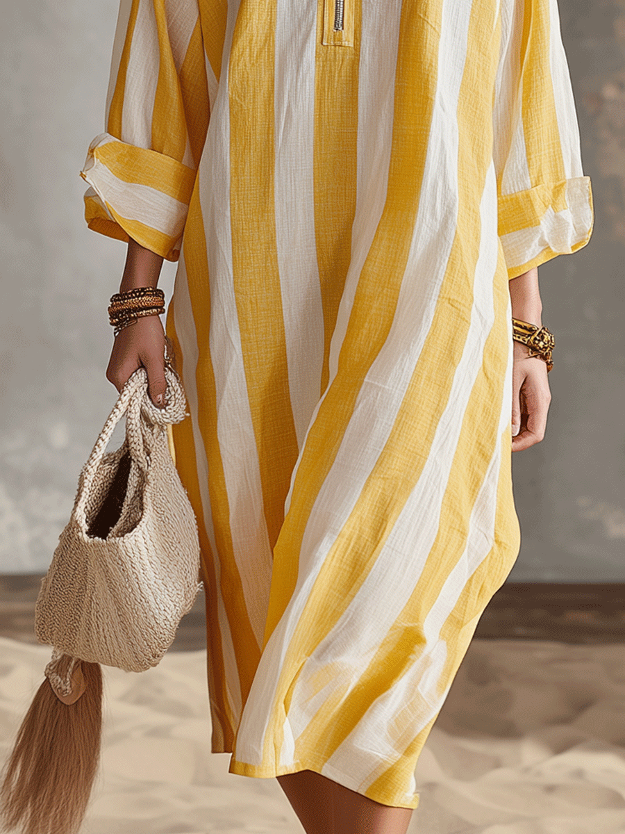 Yellow and white striped midi dress with loose drape and ruffled cuffs, side seam