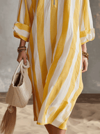 Yellow and white striped midi dress with loose drape and ruffled cuffs, side seam