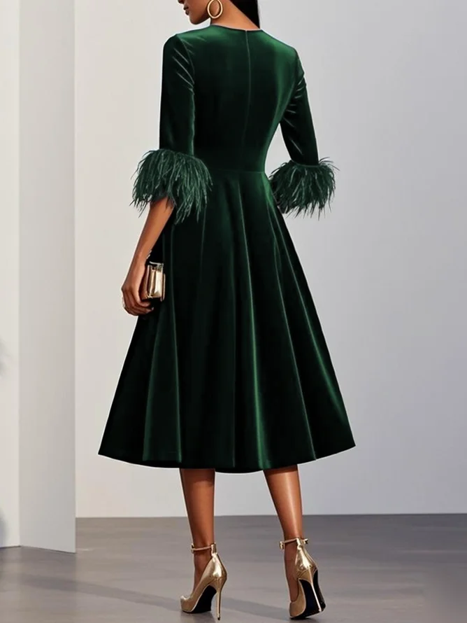 Green velvet midi A-line dress, back view with feather-trimmed sleeves