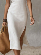 White sleeveless stand-collar midi dress with front slit hem
