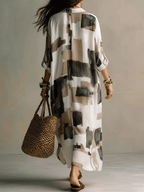 Off-white button-front maxi dress with abstract block print, relaxed fit, flowy 3/4 sleeves