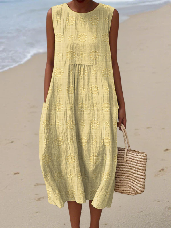 Yellow embroidered midi dress with sleeveless tiered design and round neckline.