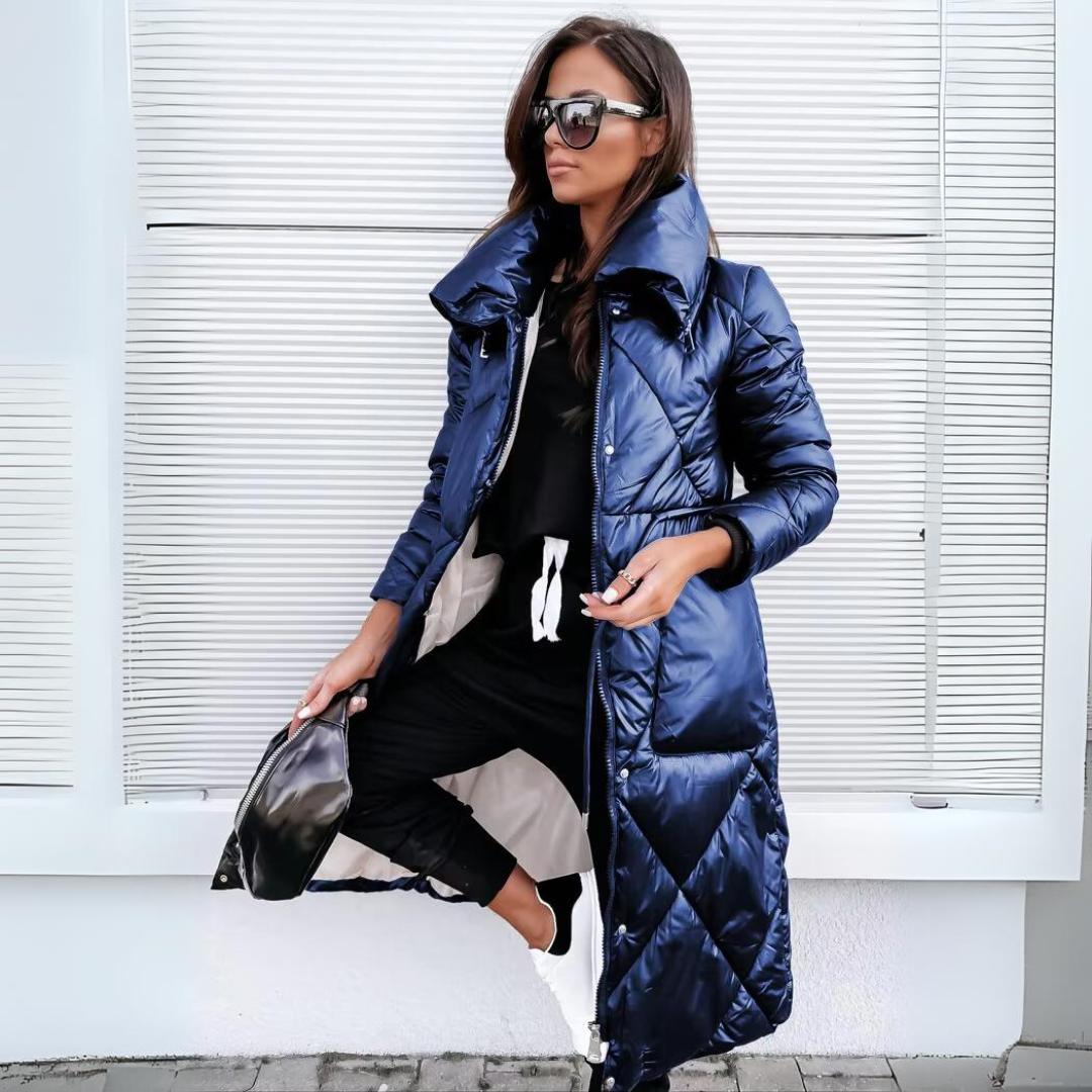 Blue quilted long puffer winter coat with hood, front zipper, side pockets.
