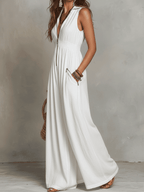 White sleeveless maxi dress with V-neck and front zip, billowy skirt