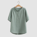 Lightweight cotton shirt in green, short sleeves, button front, ruffled crew neck.