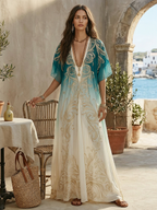 Aqua-to-cream kaftan maxi dress with cape sleeves, gold embroidery, and draped fit