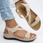 Beige orthopedic comfort sandals with crisscross strap and two buckle closures
