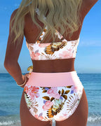 White floral contrast split bikini with pink trim, bandeau-style top and high-cut bottoms
