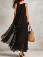 Black sleeveless layered chiffon maxi dress, flowing tiered skirt, back view