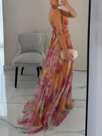 Maxi A-line dress with multicolor painted floral print, side view and flowing skirt