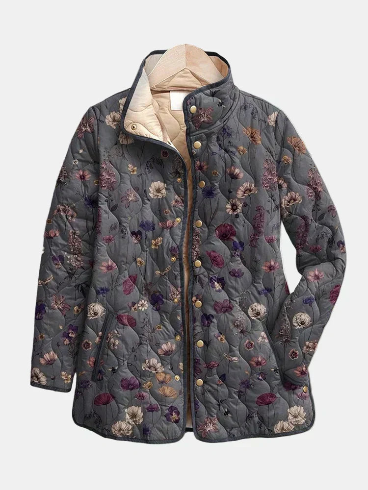 Vintage floral quilted jacket with dark navy base, hood, and button front