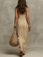 Khaki linen halter maxi dress, back view with sleeveless column cut and draped fabric