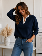 Kaitlyssa navy V-neck sweater with lace ruffle at neckline and ribbed hem