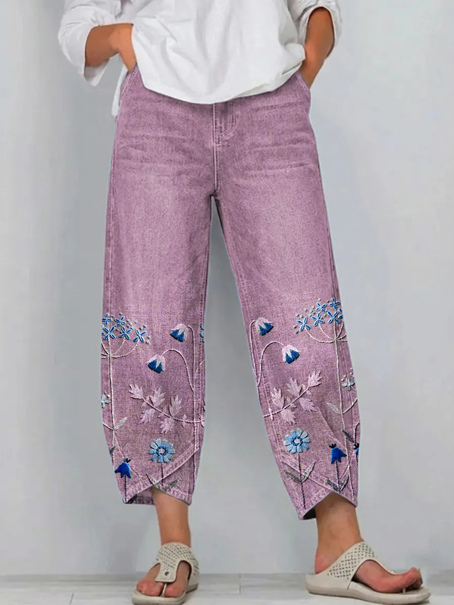 Purple casual trousers with blue-and-white floral embroidery panels on the sides