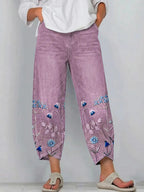 Purple casual trousers with blue-and-white floral embroidery panels on the sides