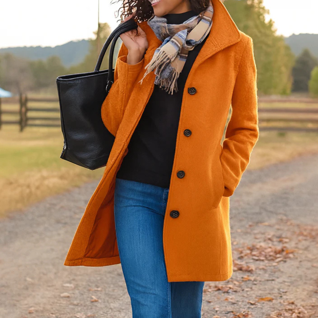 Orange long button-front coat with notched lapels and flap pockets, lined.