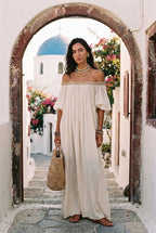 Ivory off-shoulder pleated long dress with embroidered trim at neckline
