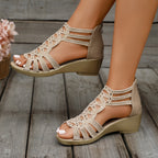 Beige women’s orthopedic sandal with ankle strap and perforated cutout design