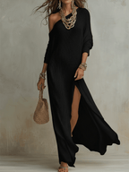 Black one-shoulder textured maxi dress with long sleeves and thigh-high slit