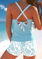Violet™ ruched tankini back with crisscross straps and bow, plus white floral shorts