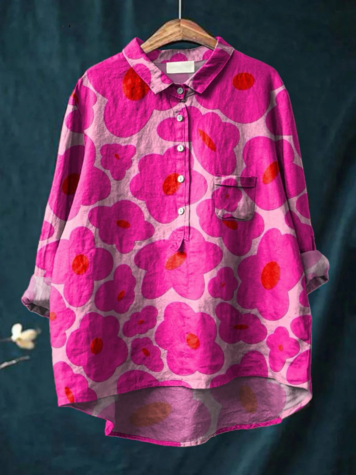 Women’s casual shirt in vibrant pink with large floral print, button-up front