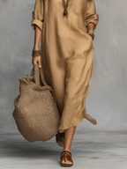 Beige buttoned midi dress with side slit and rolled sleeves, front lower body view