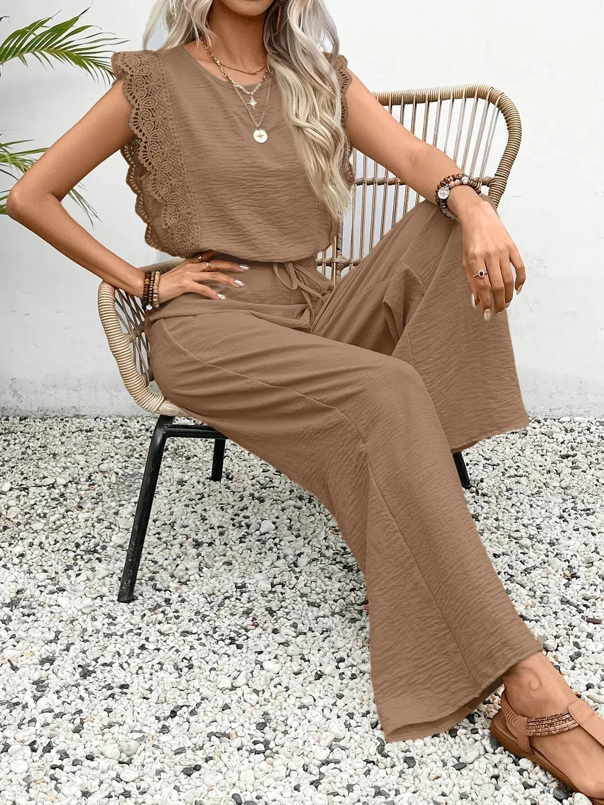 Taupe sleeveless top and flowing wide-leg pants with drawstring waist set.
