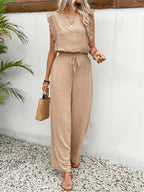 Beige sleeveless top and wide-leg pants set with lace trim, tied waist