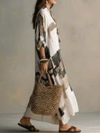 Off-white abstract maxi dress with button-front, relaxed fit, flowy hem, 3/4 sleeves