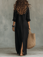 Black button-front maxi shirt dress, loose fit, 3/4 sleeves, side slit.