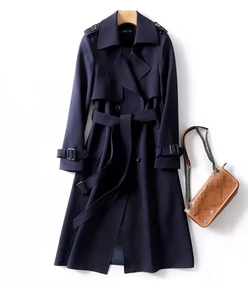 Navy trench coat with belt, double-breasted buttons, and epaulets