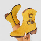 Yellow suede western boots with decorative side buckle and low block heel.