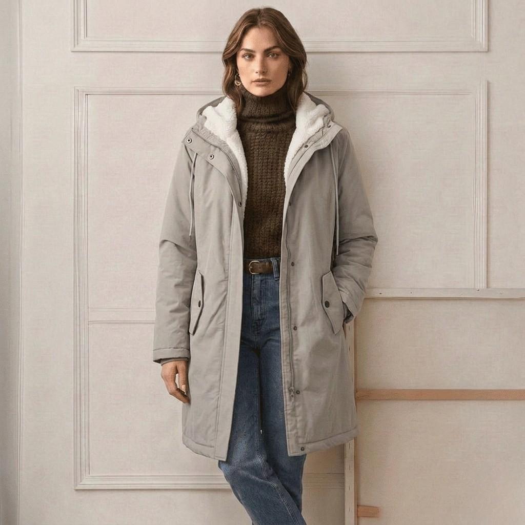 Light grey waterproof long parka with sherpa-lined hood and front zip pockets