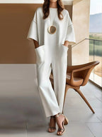 Cotton stretchy loose jumpsuit, white, short sleeves, wide-leg, gold oval detail