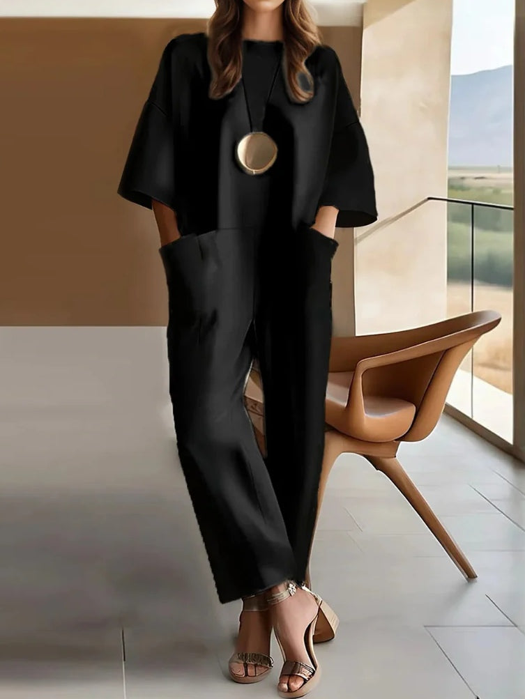 Cotton stretchy loose jumpsuit, black, short sleeves, wide-leg, gold oval detail