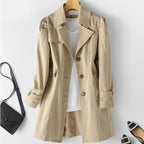 Camel women's trench coat with button front, notched lapels, flap pockets
