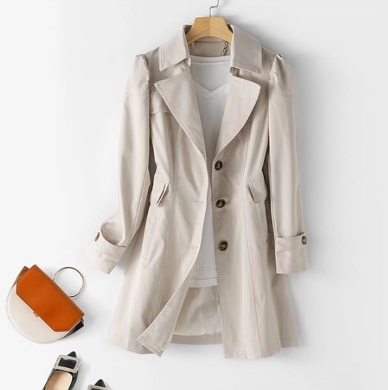 Beige women's trench coat with button front, notched lapels, flap pockets