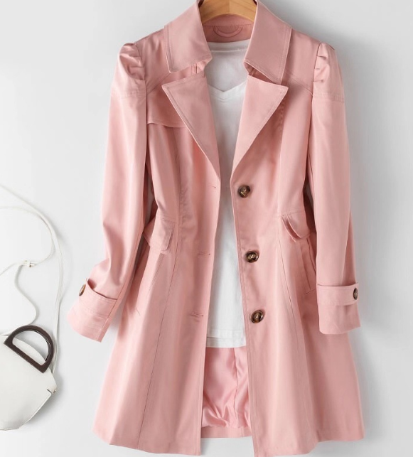 Light pink women's trench coat with button front, notched lapels, flap pockets
