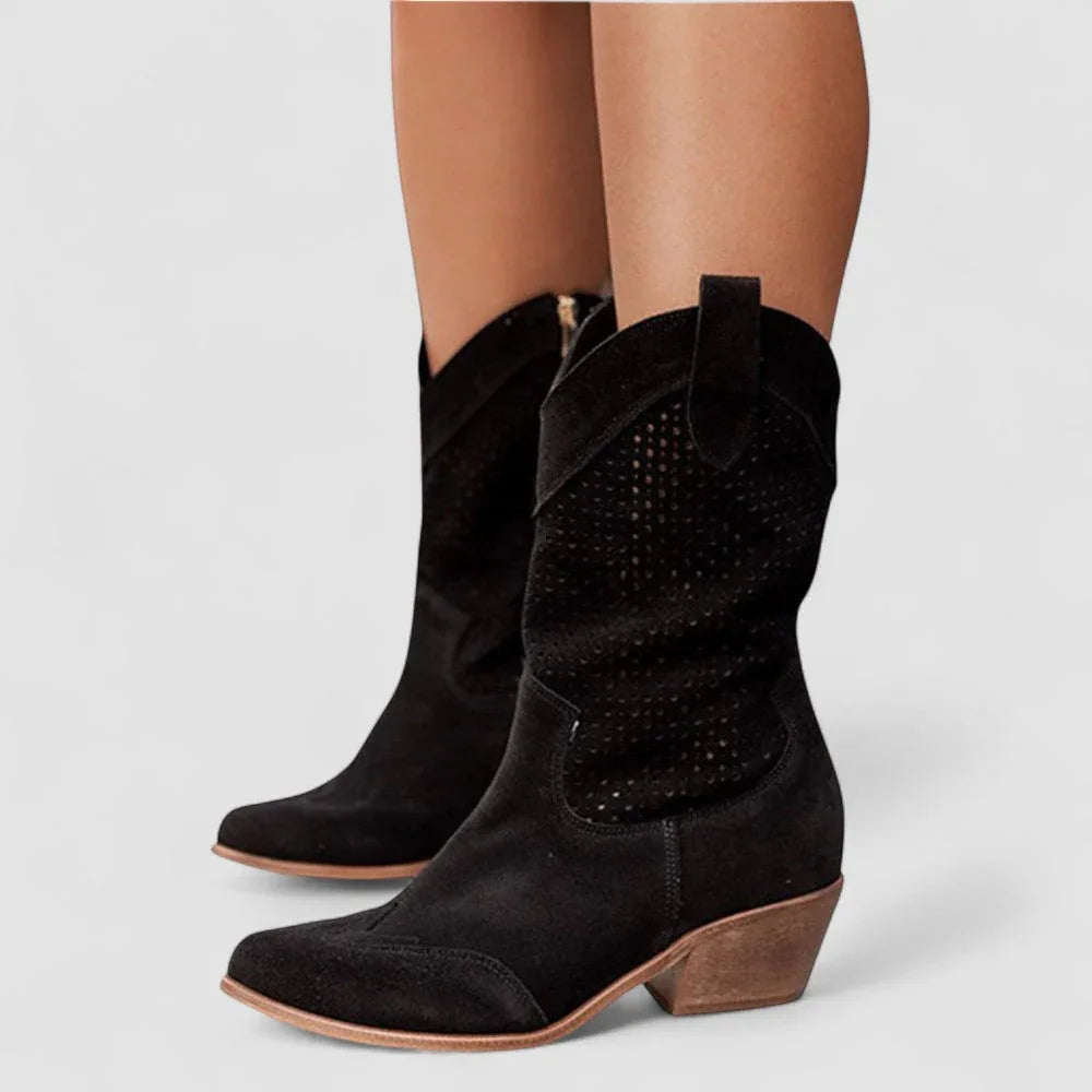 Black orthopedic western boots with perforated accents and stacked heel