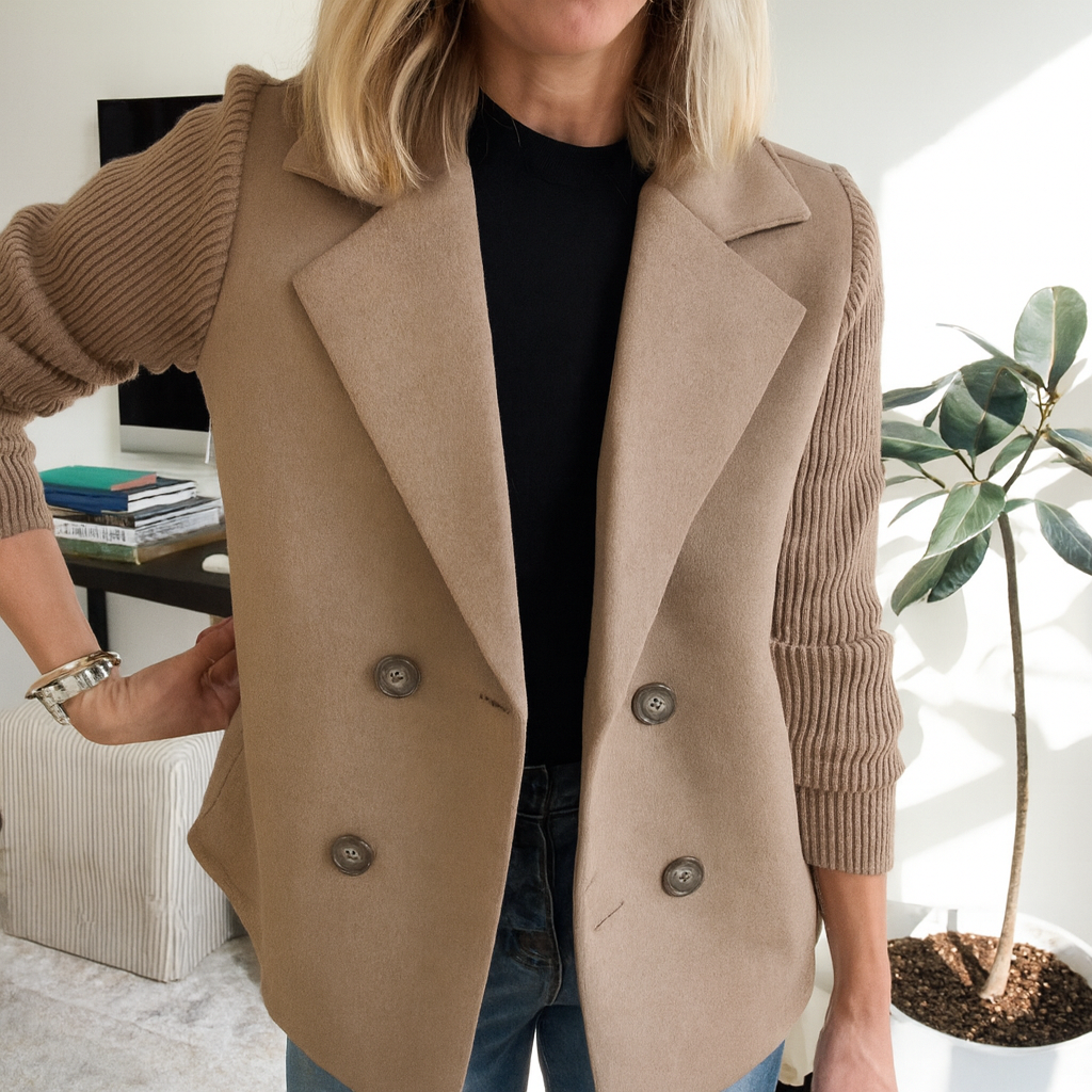 Ribbed blazer coat in rust brown, hanging on a wooden hanger with double-breasted buttons