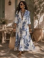 Blue floral button-front maxi dress with tiered skirt and elbow puff sleeves