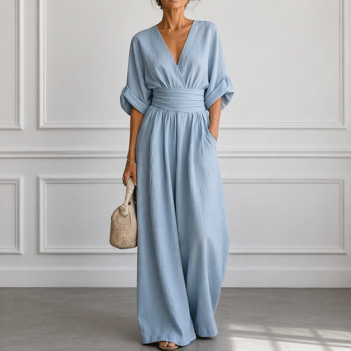 Light blue wrap V-neck jumpsuit with elastic waist and wide-leg pants