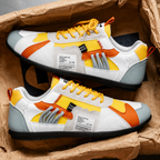 Retro sneakers in a box: white with orange and yellow panels, yellow lace-up