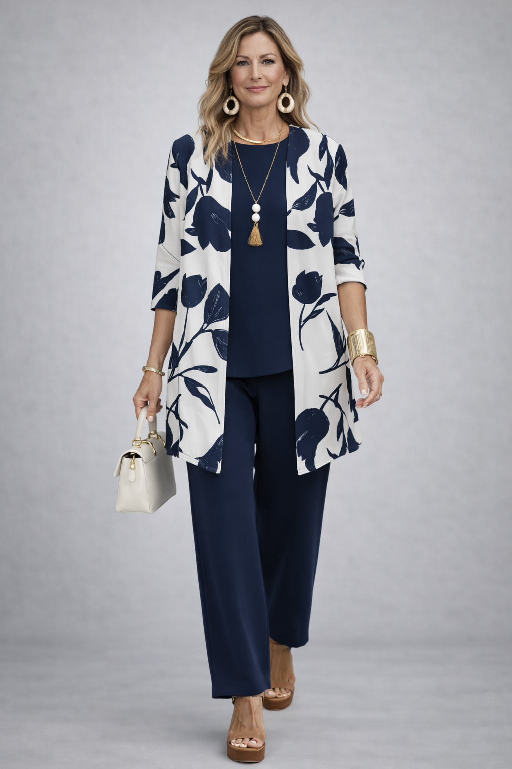 3-piece outfit set with navy pants, navy top, and white floral jacket