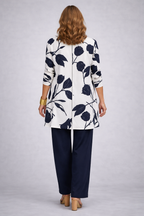 3-piece outfit set back view: white floral jacket over navy pants and top